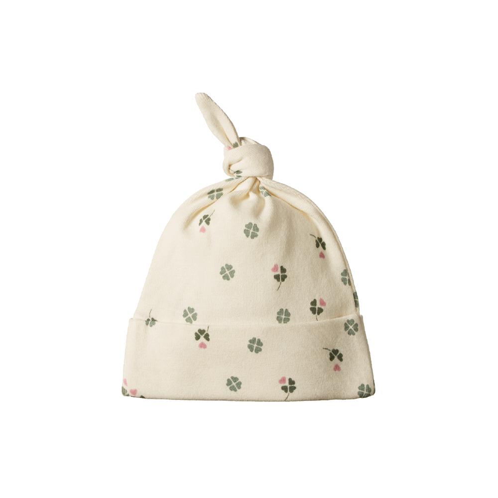 Cotton knotted beanie with green and pink clover pattern on a white background