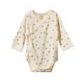Cream kimono style organic cotton bodysuit with green and pink clover  pattern on a white background