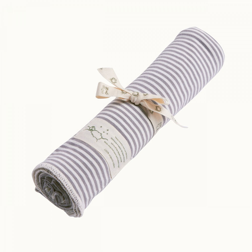 Rolled-up gray and white striped jersey cotton fabric with a bow on a white background