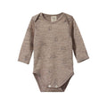 Brown merino baby bodysuit with long sleeves and envelope neck with soft bunny design pattern on a white background