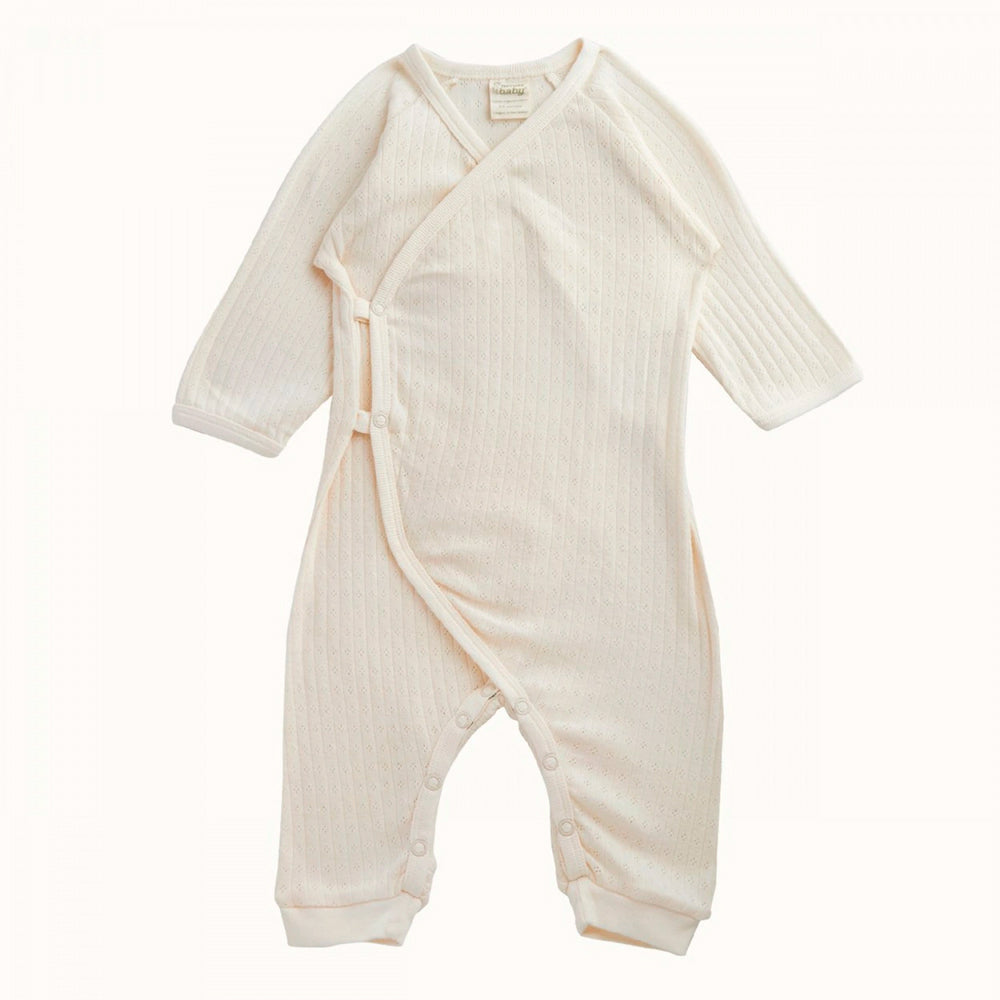 Nature Baby cotton pointelle kimono style stretch and grow suit on a white background