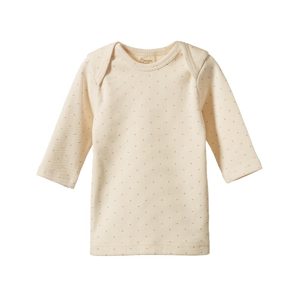 Cream baby long-sleeve shirt with small  caramel coloured dot patterns on a white background
