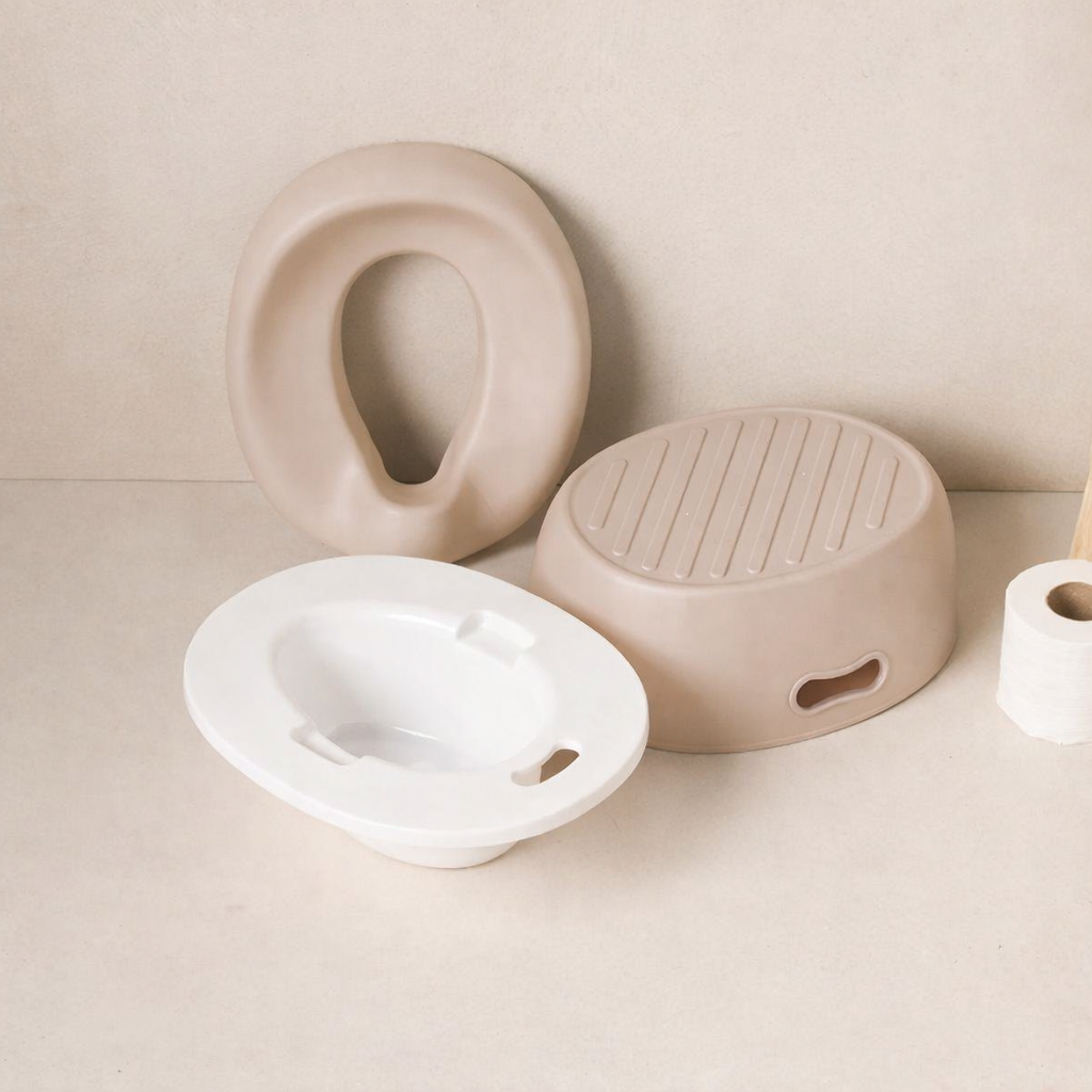 3 parts of Nattou Baby Potty on a beige surface