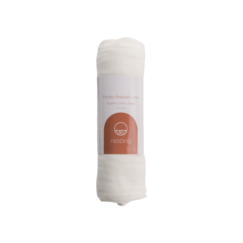 Folded white blanket with a label on a white background