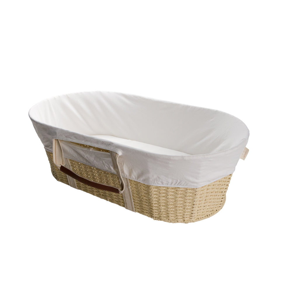 Wicker baby Moses basket with white cover on a white background