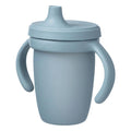 Blue sippy cup with handles on a white background