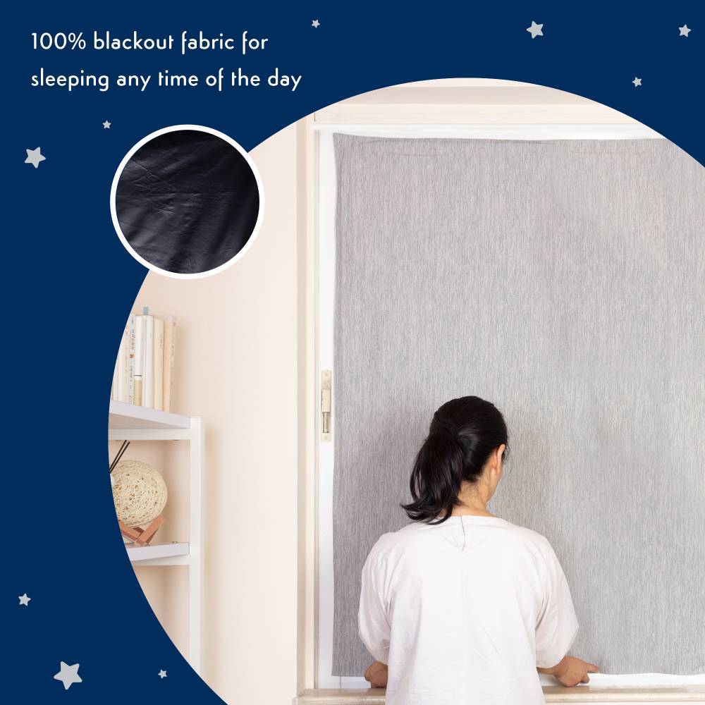 Woman using a suction blackout blind with text about 100% blackout fabric.