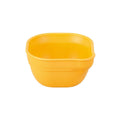 A Re-Play Dip 'n' Pour Bowl - Sunny Yellow on a white background