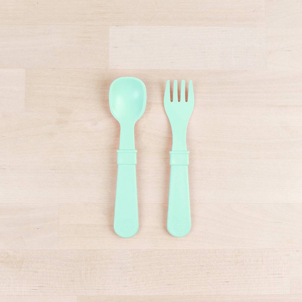 A Re-Play Fork and Spoon - Mint on a white background