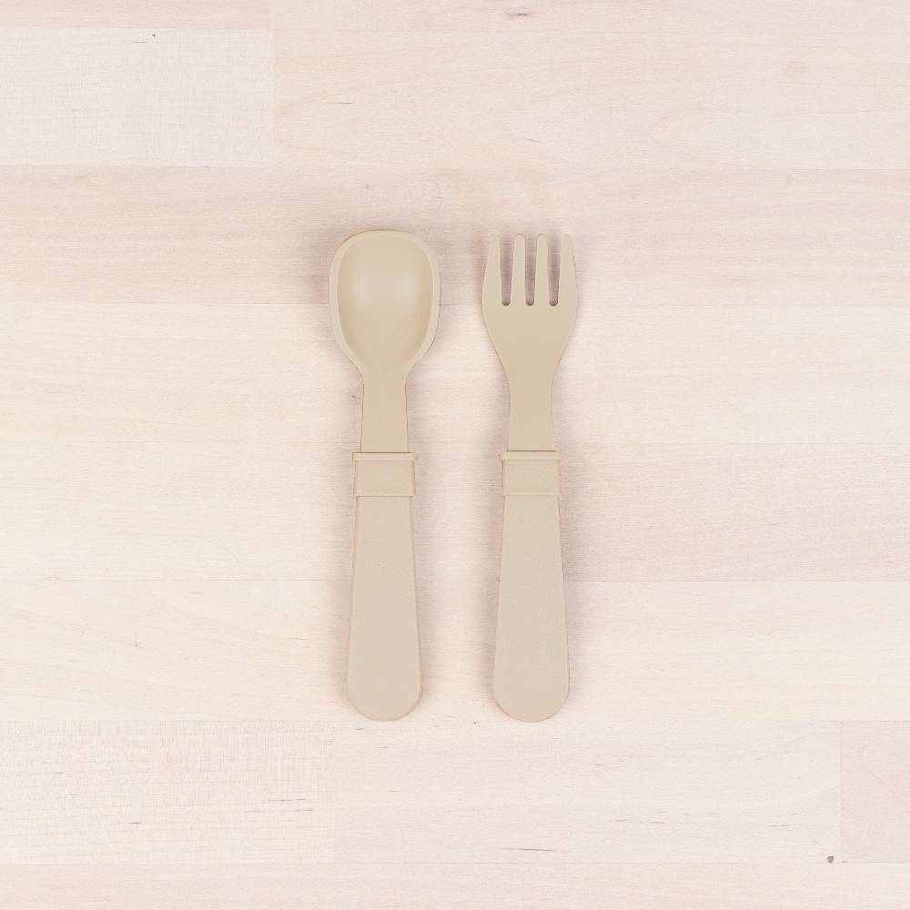 A Re-Play Fork and Spoon - Sand on a white background