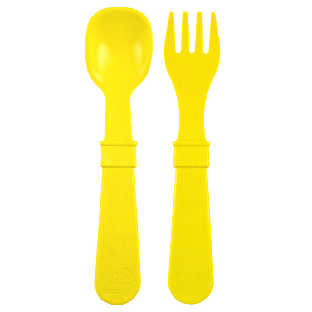 A Re-Play Fork and Spoon - Yellow on a white background