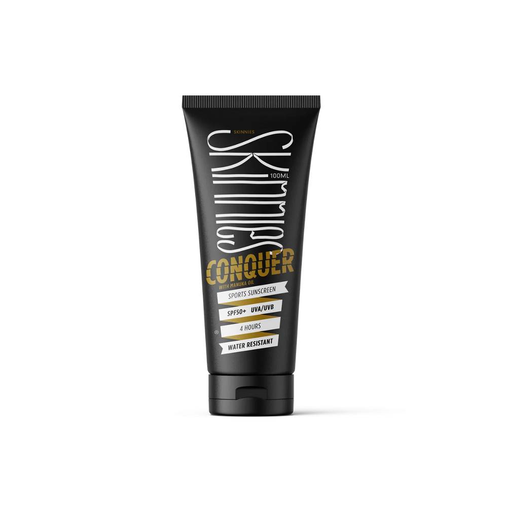 Black Skinnies sunscreen bottle against white background.