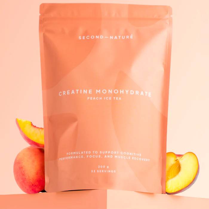Pink Second Nature powder pouch against pink background.