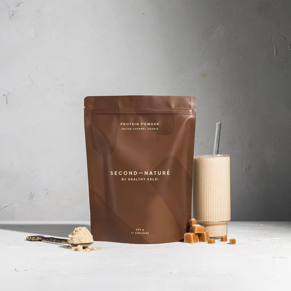 Brown Second Nature protein powder pouch against grey background.