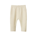 Cream waffle texture baby leggings on a white background