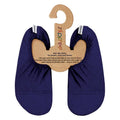 Pair of navy slip-free shoes on a hanger with slipfree branding on a white background