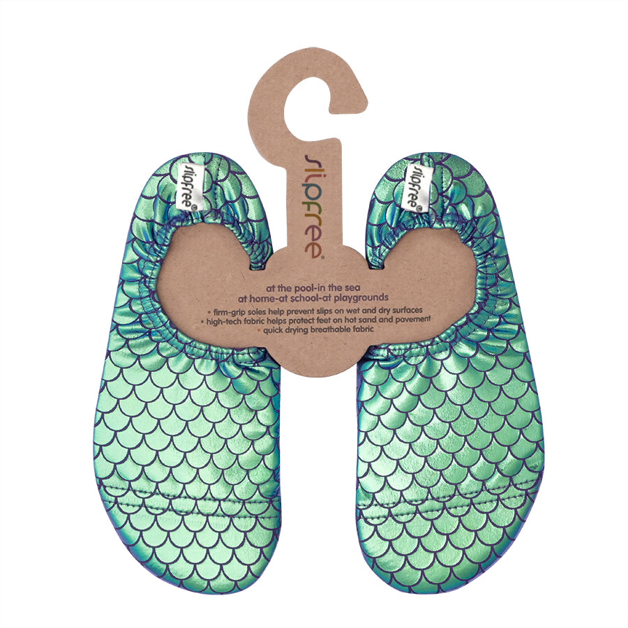 Green metallic Mermaid scale patterned slipfree water shoes on a hanger with a brand label.