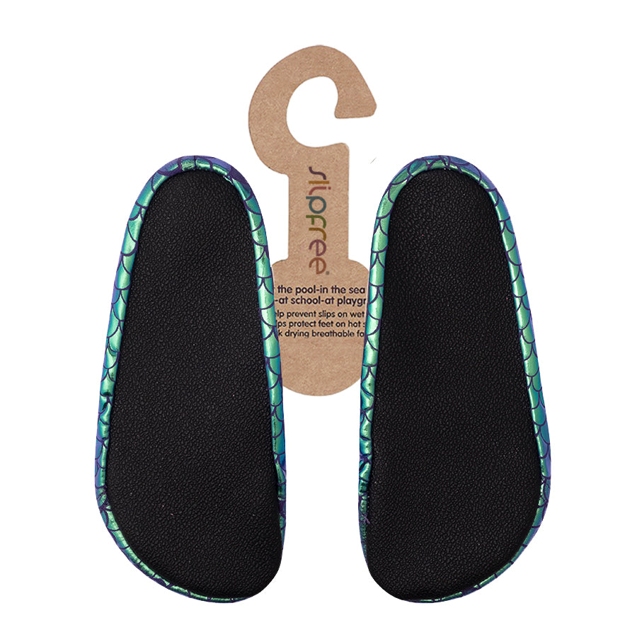 Black insole with green mermaid pattern on a white background
