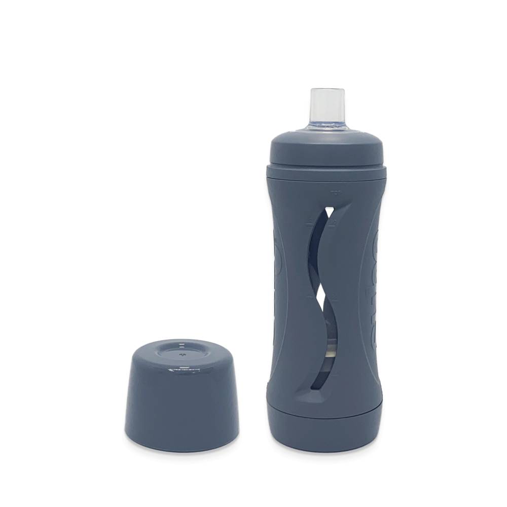 Gray food bottle with cap on a white background