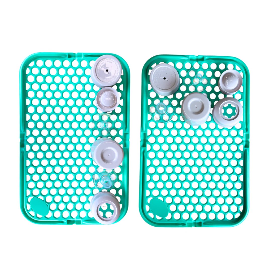 Turquoise silicone mesh cleaning pouch on a white background