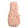 Pink baby sleeping bag with elephant pattern on a white background