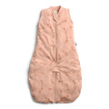 Pink baby sleeping bag with floral pattern on a white background