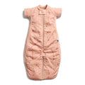 Pink baby sleeping bag with subtle pattern on a white background