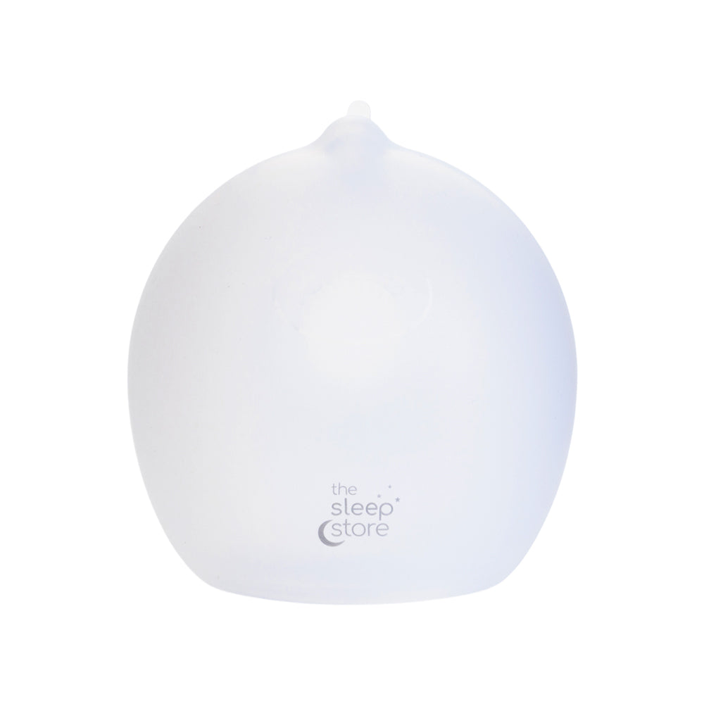 Clear silicone breastmilk collector with 'The Sleep Store' logo on a white background