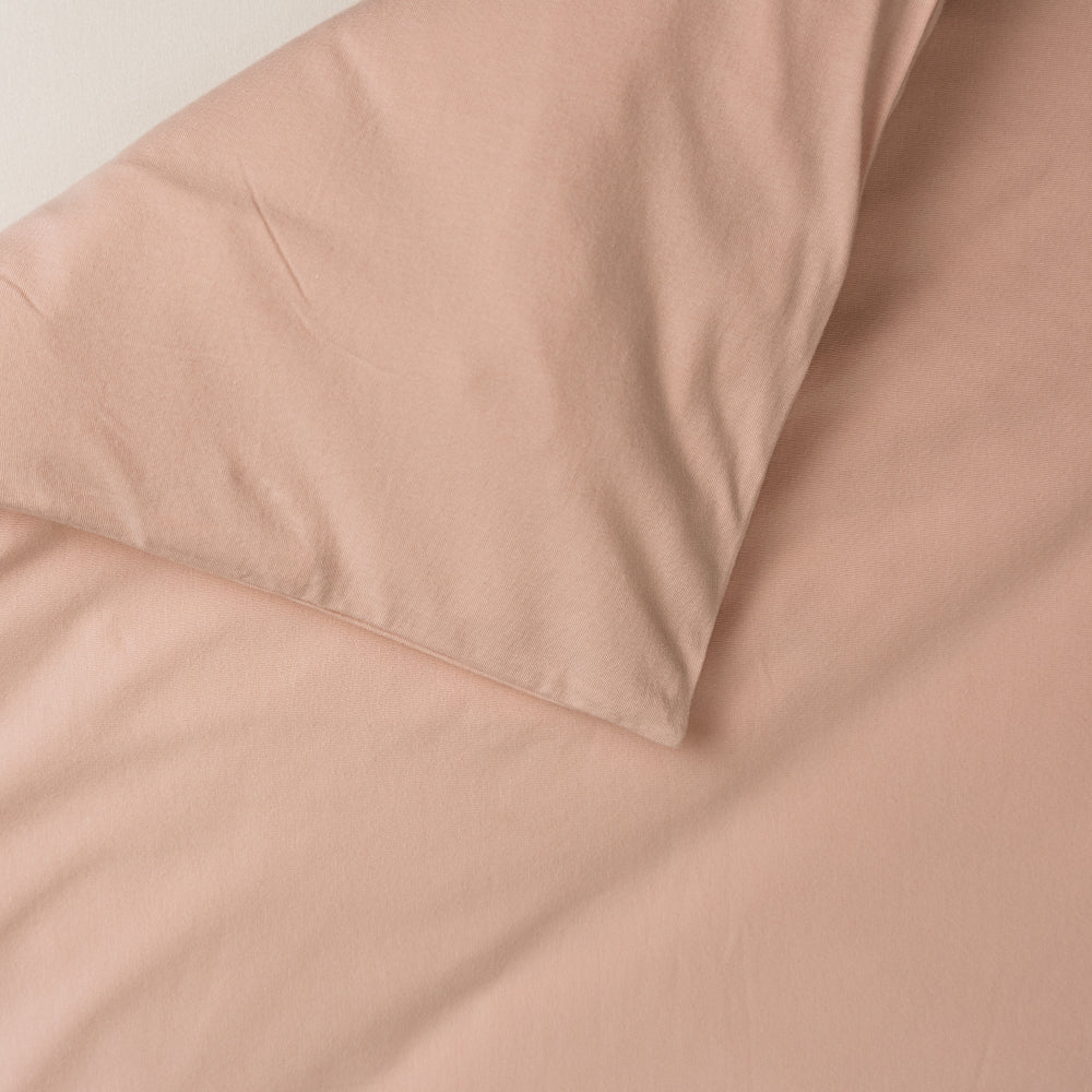 Cotton duvet cover in a solid blush pink colour. 
