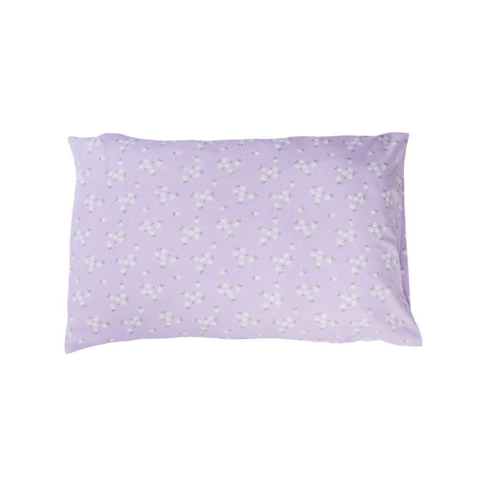 Cotton toddler pillowcase on a white background. Lilac base with an all over floral print. 