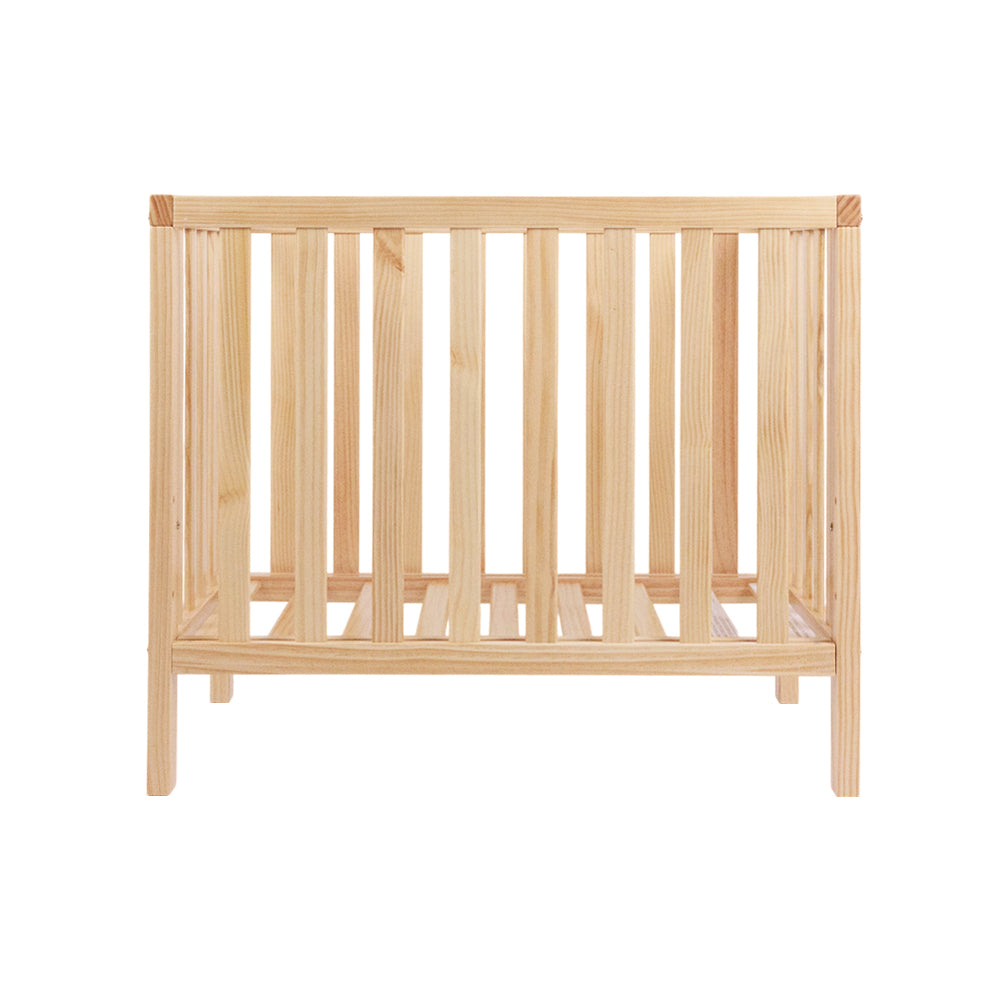 Small mini frank cot with mattress on a white background