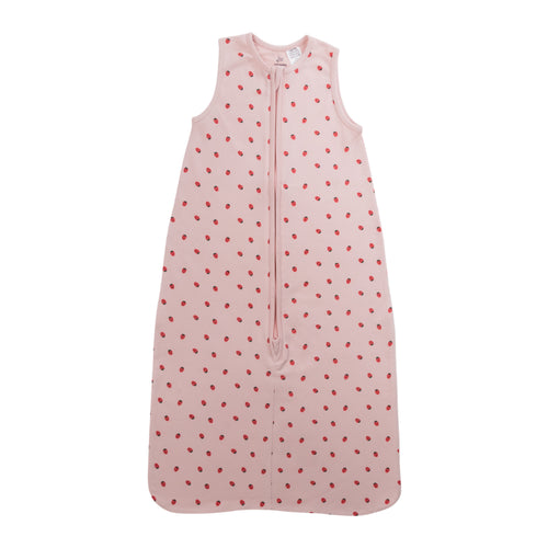 A sleeveless cotton baby sleep sack with strawberries on a pink background, shown flat against a white background.
