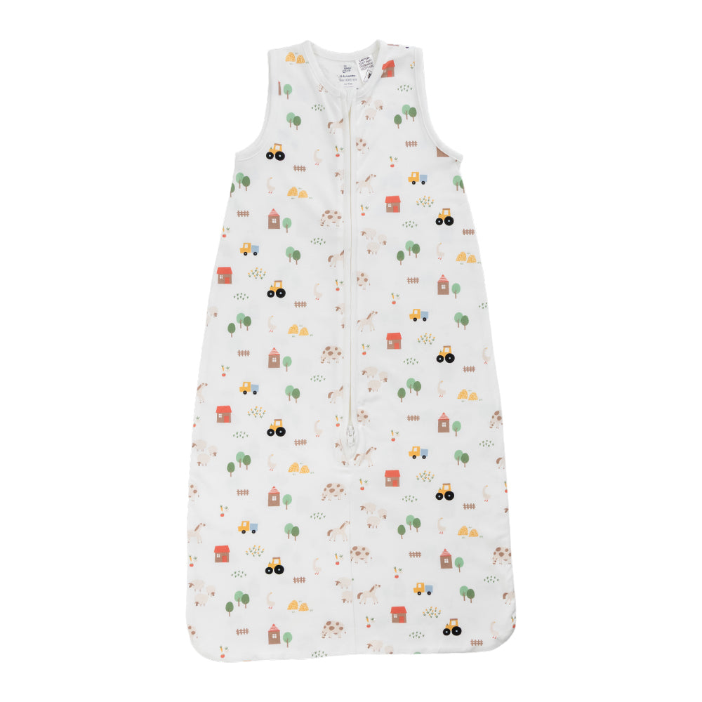 A sleeveless cotton baby sleep sack with a farmyard print, shown flat against a white background.