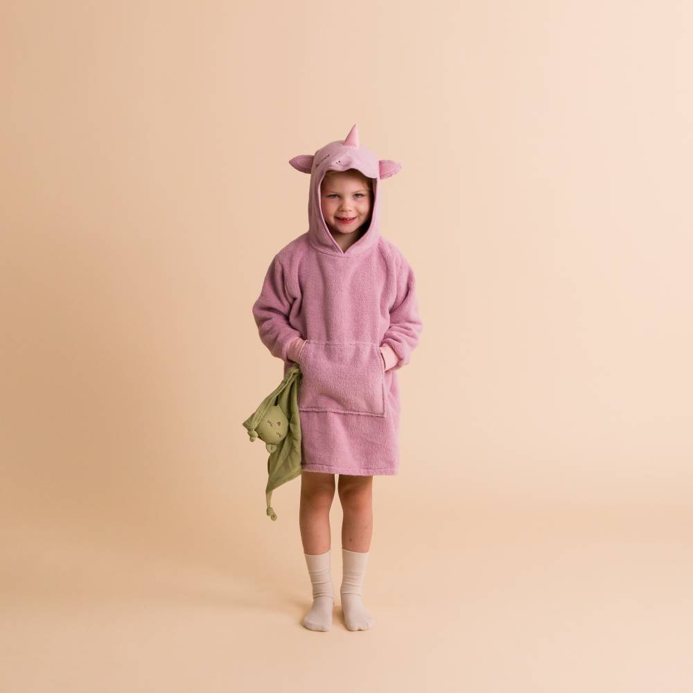 Child wearing a pink unicorn towelling lounge hoodie