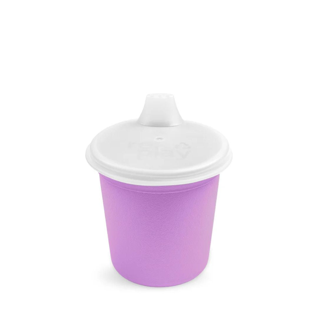 A purple silicone baby cup with a white lid and spout, shown on a clean white background.