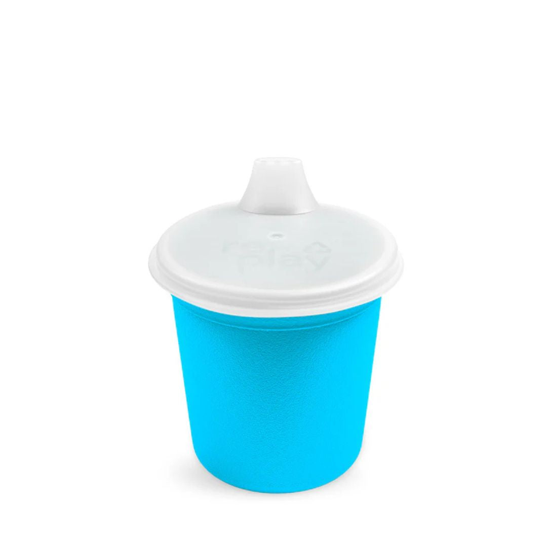 Blue sippy cup with a white lid on a white background