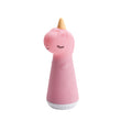 Pink Unicorn shaped silicone torch with yellow horn on a white background