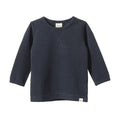 Cotton navy blue waffle textured long-sleeve shirt on a white background
