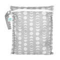 Grey lunar phase bumkins wet bag with handle on left side against a white background