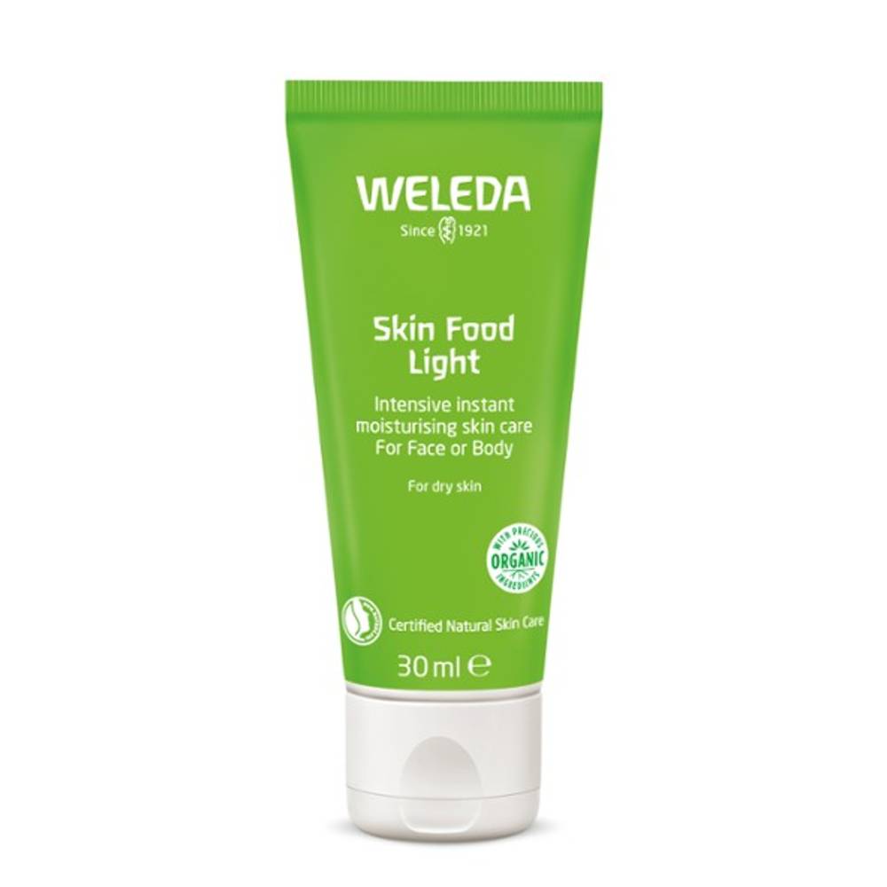 A tube of Weleda Sking Food Light on a white background.