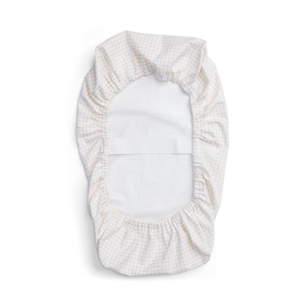A waterproof fitted sheet shown on a mattress in Caramel Grid pattern