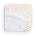 A waterproof fitted sheet shown on a mattress in Caramel Grid pattern