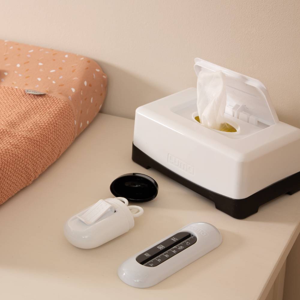 Snow White LUMA Wipes Box on a dressing station with other LUMA baby care items.