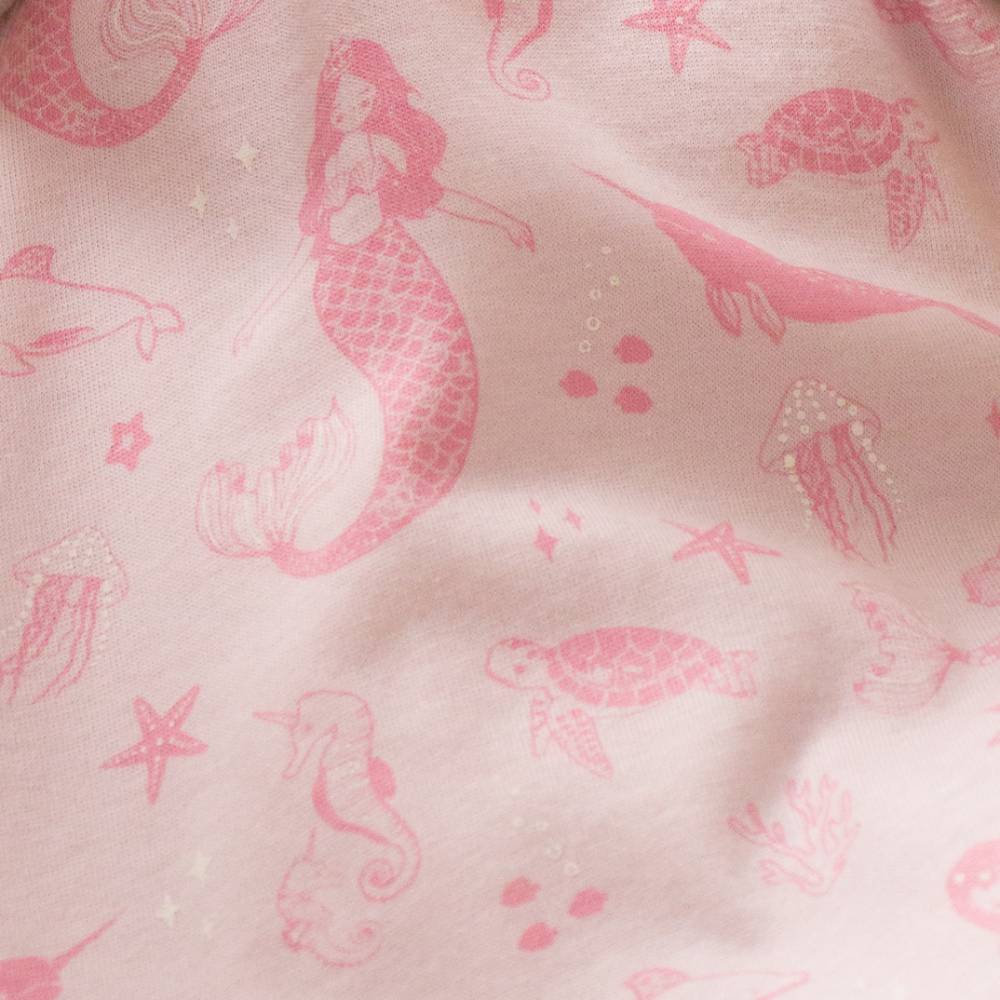 Pink mermaid and sea creature pattern on a light pink fabric background