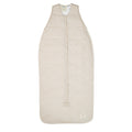 Beige baby sleeping bag with a subtle Maori wave pattern on a white background