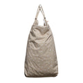 Beige large wet bag with white polka dots on a white background