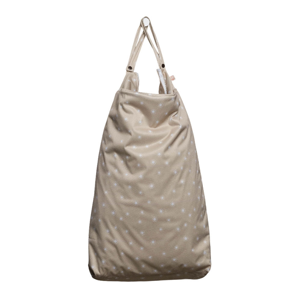 Beige large wet bag with white polka dots on a white background