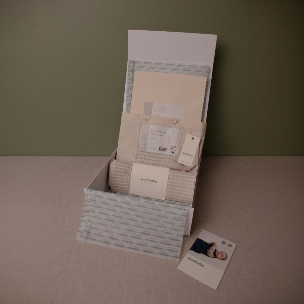 Collection of stationery items including cards and a box on a neutral background