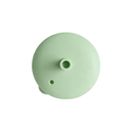 Light green silicone lid on a white background