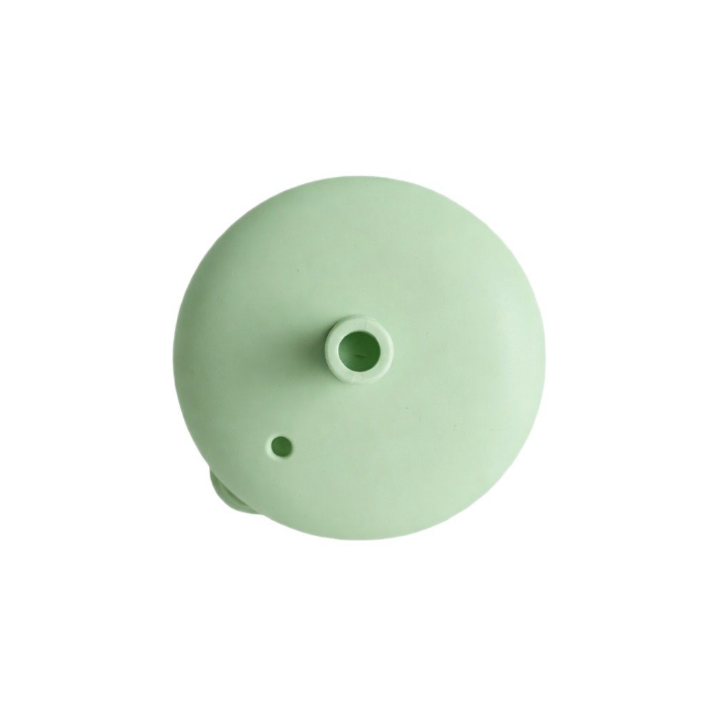 Light green silicone lid on a white background